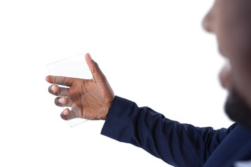 Businessman holding a glass smartphone