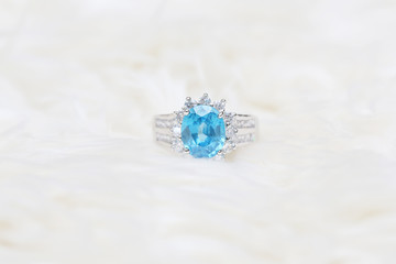diamond ring and blue gemstone