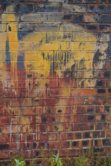 Brick wall with spray painted graffiti