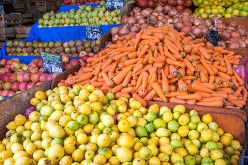Piles of fruits and vegetables for sale at a market in Valparaiso, Chile