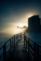 Sunrise over the Children's Pool jetty in La Jolla, California