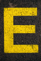 Letter E on asphalt road