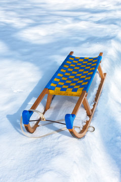 Wooden sledge in winter snow