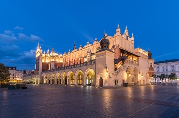 Naklejka na ściany i meble Cloth Hall on Main Market Square in Krakow, illuminated in the night