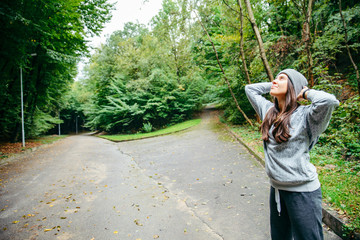 woman stretching in city park