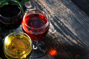 close-up of wine glasses on a wooden background