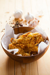 fried chicken in wooden bowl
