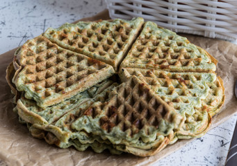 Home made waffles with spinach, heart shaped. Delicious breakfast