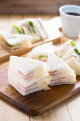 mini ham sandwich with coffee for breakfast.