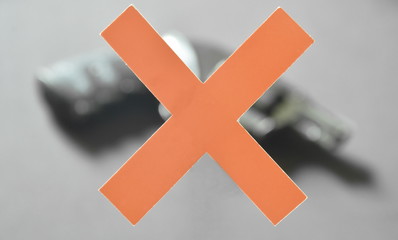 red paper cross blurry revolver for anti gun violence and crime