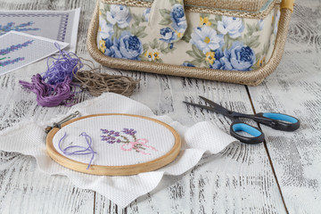Embroidery Flowers. Sewing accessories. Canvas, hoop, thread mouline. Needlework. Hand embroidery © Andrey Cherkasov