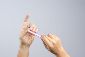 Hand holding nail file for manicuring and pedicure, a cosmetic tool