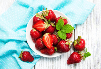 ripe strawberries on wooden table