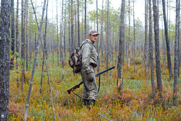 Fototapeta premium hunter in the pine forest
