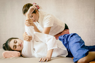 Women is getting Thai Massage Spa stretching © junce11