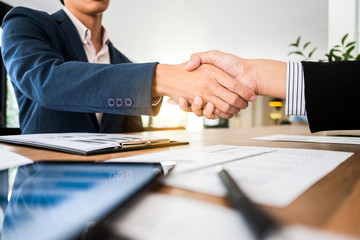 business executives partnership hand shaking