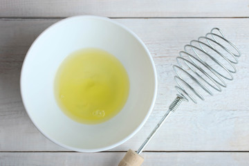 Broken chicken egg in a plate