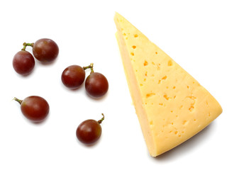 piece of cheese with grapes isolated on white background