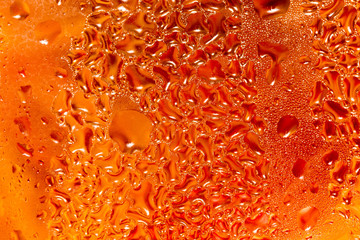 abstract background of drops on a red glass