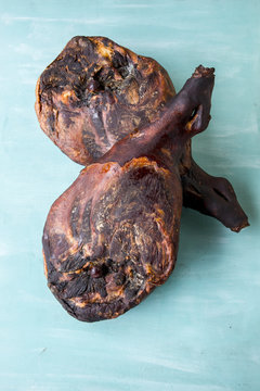 Jamon serrano. Traditional ham on turquoise background