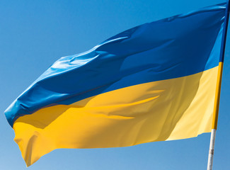 flag of Ukraine against the blue sky