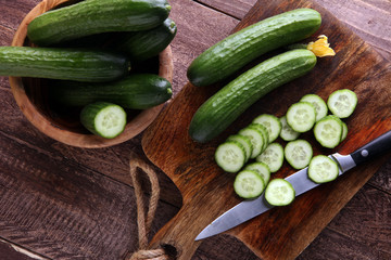 Fresh and sliced cucumbers. Sliced cucumbers on a cutting board. cucumbers for diet and healthy eating