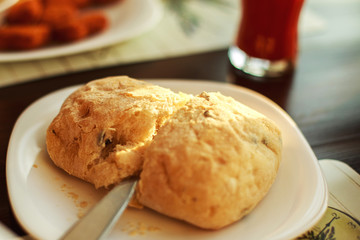man cuts fresh bread with a knife