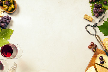 Wine appetizers set: French cheese selection, grapes and walnuts on concretebackground