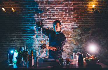 Man working at cocktail bar
