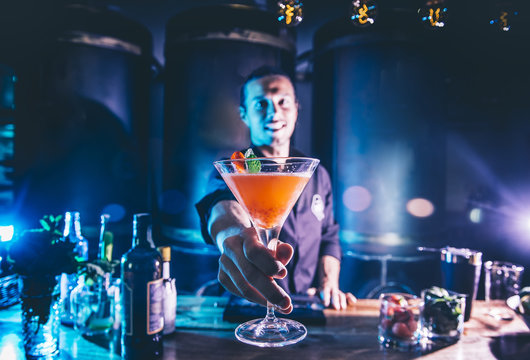 Man working at cocktail bar