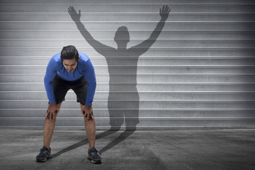 Handsome asian runner man with a shadow of spirit