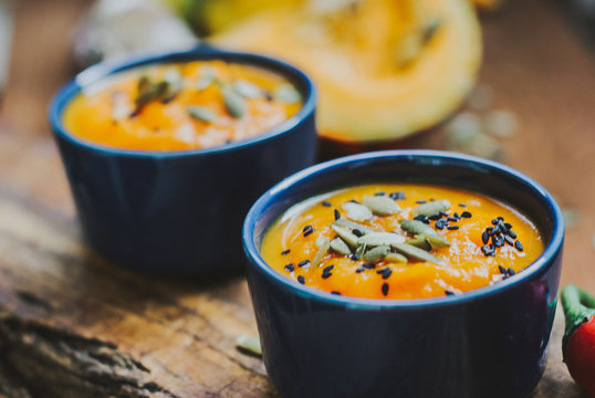 Homemade vegetable soup with pumpkin with cream and black sesame, pumpkin seeds