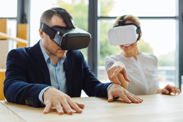 Cheerful positive people enjoying virtual reality