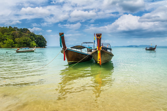 Amazing view of beautiful beach with longtale boats. Location: Krabi, Thailand, Andaman Sea. Artistic picture. Beauty world.