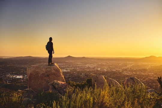 Young Bearded Millennial Man Hiking On Top Of Hill In California Over Looking San Diego At Sunset