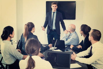 Male manager making presentation in office