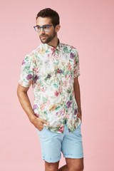 Dude in spectacles and floral shirt, looking away
