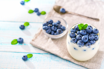 Healthy breakfast of yogurt and  blueberries.Top view