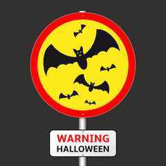 Warning Halloween road sign with bats silhouettes