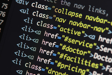 Obraz premium Real Html code developing screen. Programing workflow abstract algorithm concept. Lines of Html code visible.