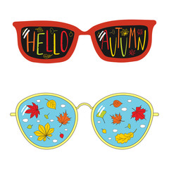 Hand drawn vector illustration of vintage glasses, with text Hello Autumn, falling leaves and clouds inside the lenses.