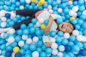 Asian Little Chinese Girl Playing At Balls Pool