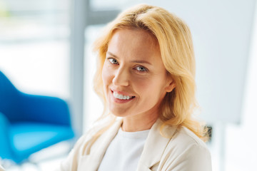Portrait of smiling female that posing on camera