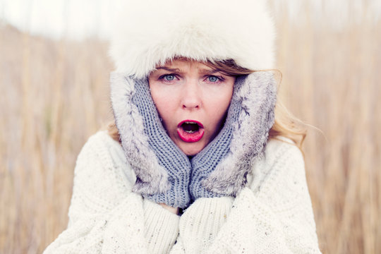 Shocked woman waiting for cold weather