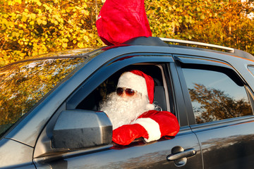 Authentic Santa Claus. Santa Claus drives a car.