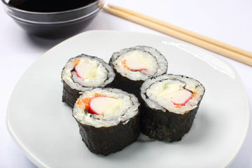 Sushi in a plate. White plate white background.