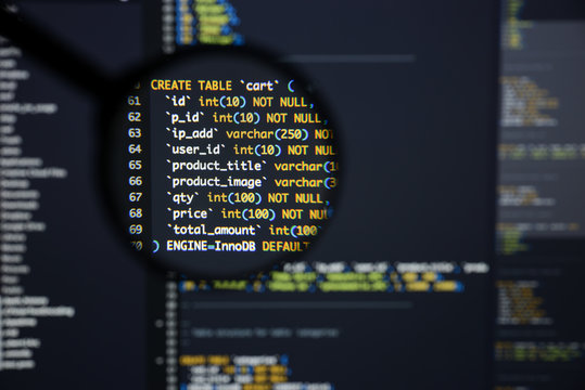 Real Php code developing screen. Programing workflow abstract algorithm concept. Lines of Php code visible under magnifying lens.