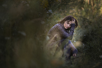 sad and pensive woman in casual clothes