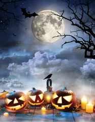 Muurstickers Spooky halloween pumpkins on wooden planks © Jag_cz