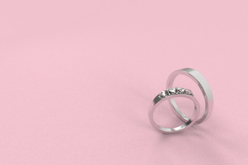 3d rendering. A pair of wedding rings on pink background